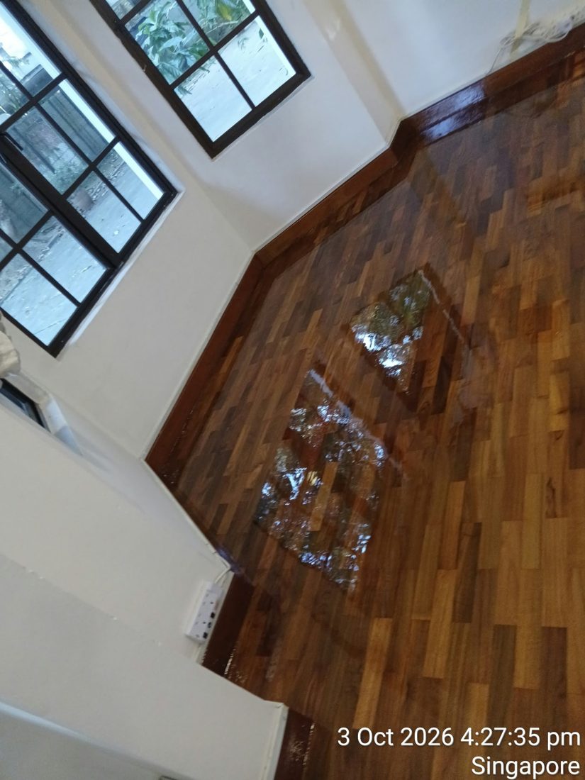 Windows reflected in freshly varnished strip parquet