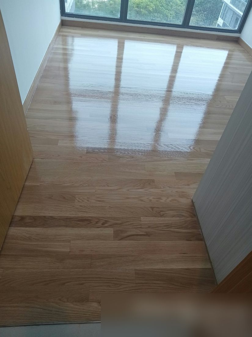 Light oak strip floor in a bedroom after varnish